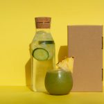 jar of cucumber water and green drink with pineapple