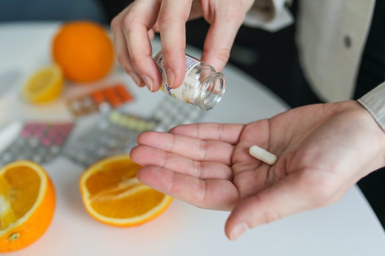 man dumping 1 pill into hand