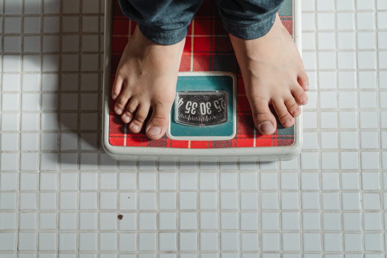 person standing on a scale at 32 pounds