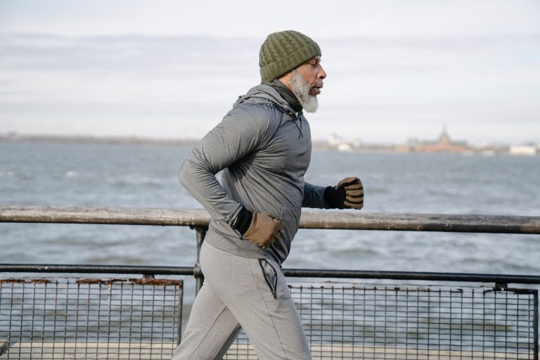 man jogging by the ocean