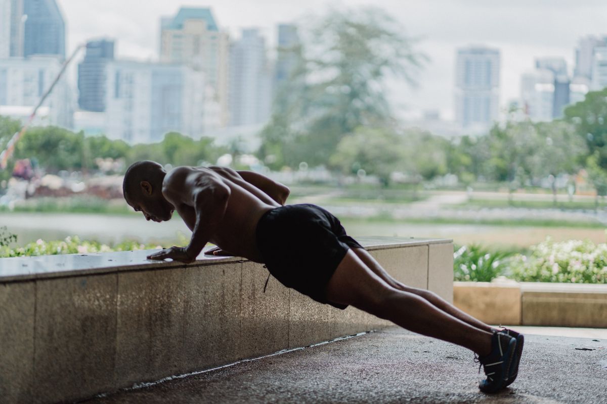 Man holding a push-up position with a straight body line